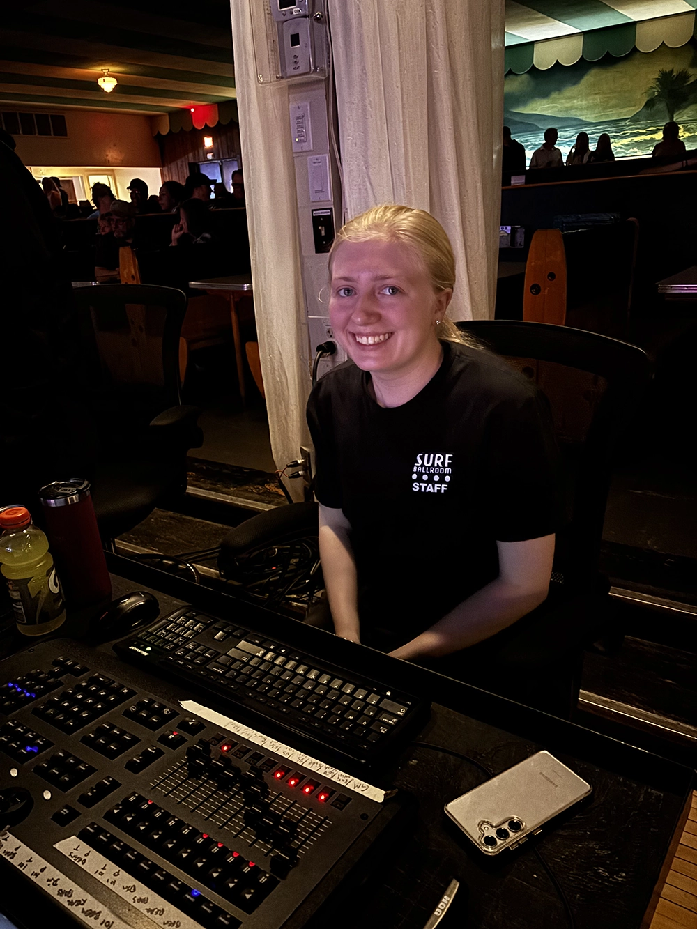 Intern Ashlynn working the soundboard